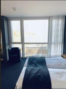 En eller flere senge i et værelse på Work Life Residence by Frauenfeld