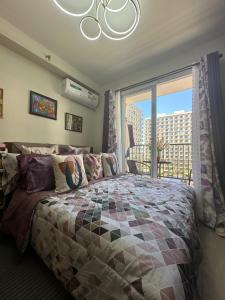 Postel nebo postele na pokoji v ubytování DawnJay Cebu Cozy Studio flat + 31 fotografií