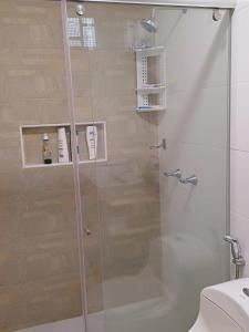 a shower with a glass door in a bathroom at Casa Bellavista Barranquilla in Barranquilla
