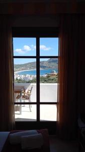 a view of the ocean from a room with a window at Olive Grove in Plakias