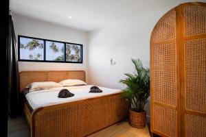 Postel nebo postele na pokoji v ubytování Luxury Beachhouse Manao Villas