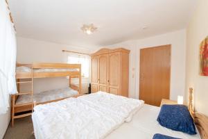 Postel nebo postele na pokoji v ubytování Feriendorf Reichenbach - Bgm.-Martin-Str. 9/3