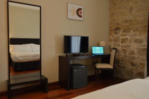 Posteľ alebo postele v izbe v ubytovaní Hotel Baeza Monumental by eme hoteles