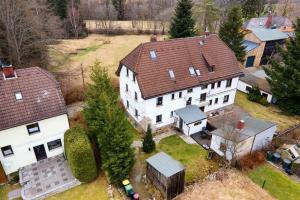 an aerial view of a large white house with a yard at Buchhaus Vier - Erdgeschoss in Kirchenlamitz