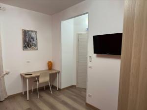 TV a/nebo společenská místnost v ubytování Casa comoda e rilassante