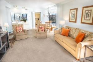 a living room with a couch and chairs at Carol Bay 503 in Myrtle Beach