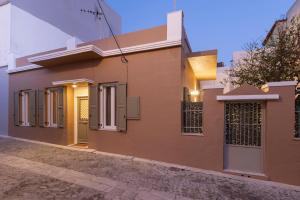 a rendering of a house in a street at Loukoumi in Ermoupoli