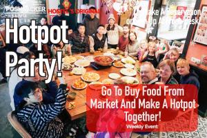 a group of people sitting around a table eating food at Chengdu Flipflop Hostel Poshpacker (Chunxi Road Metro Station) in Chengdu