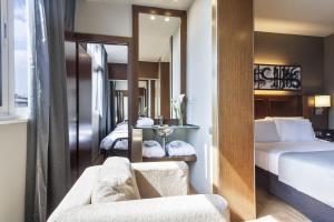 Posteľ alebo postele v izbe v ubytovaní Acta Atrium Palace