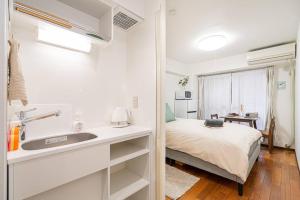 Katil atau katil-katil dalam bilik di 新宿中心地歌舞伎町紧邻伊势丹电器城免费Wi-Fi。