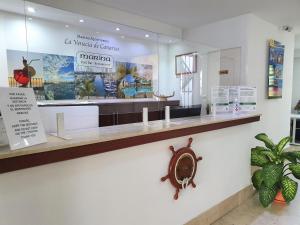 a store with a large window with a nautical sign at Billy's Puerto de Mogán Apartments by LIVVO in Puerto de Mogán +41 photos