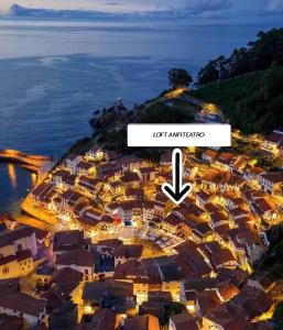 an aerial view of a city at night at Loft Anfiteatro Cudillero in Cudillero