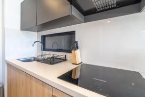 a kitchen with a sink and a counter top at Classy 1BR in Chapinero in Bogotá