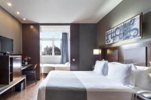Posteľ alebo postele v izbe v ubytovaní Acta Atrium Palace