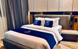 Posteľ alebo postele v izbe v ubytovaní Qube Hotel by 98hospitality