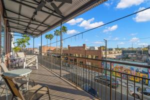 a balcony with chairs and a view of a city at NEW! Sangria Suite - Upscale Ybor City Studio, Right On 7th Ave in Tampa
