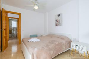 En eller flere senge i et værelse på Inftour Peñon de Ifach Apartamento