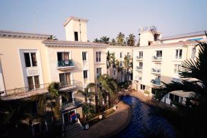 an aerial view of buildings with a river in front at Asta by Avim in Goa