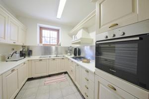 Kuchyň nebo kuchyňský kout v ubytování La Corte di Nonna Gemma - Holiday Home