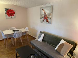 a living room with a couch and a table at Gite Normandie mer in Saint-Germain-sur-Ay