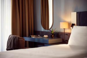 Postel nebo postele na pokoji v ubytování Van der Valk Hotel Hilversum/ De Witte Bergen