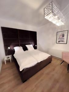 Cama o camas de una habitación en Wohngut-Appartement 50qm 2, Zimmer für max 5 Pers inklusive Parkplatz