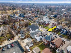 an aerial view of a city with houses and a yellow arrow at Modern Luxury 4BR 3 5BA Oasis in Historic Old Town East PD in Columbus