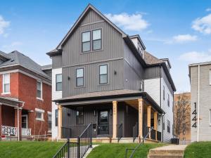 a house with a gambrel roof at Modern Luxury 4BR 3 5BA Oasis in Historic Old Town East PD in Columbus