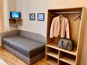 a bedroom with a bed and a closet at Pension Karnet in Prague