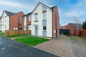 a house on a street with a fence at Wharf House TSAC in Stockton-on-Tees