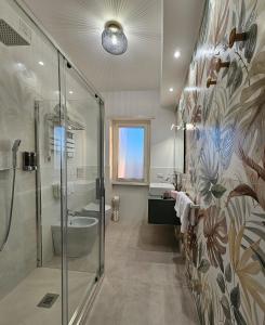 a bathroom with a shower and a sink at B&B Domus Teano Luxury Rooms in Rome
