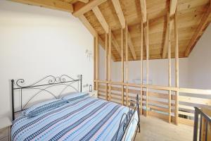 Postel nebo postele na pokoji v ubytování La Corte di Nonna Gemma - Holiday Home