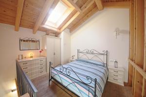 Postel nebo postele na pokoji v ubytování La Corte di Nonna Gemma - Holiday Home