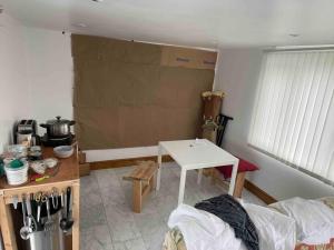 a living room with a table and a table sidx sidx sidx at Large ensuite room in Dulwich (Gipsy Hill) in West Dulwich