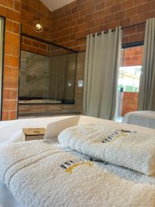 Ein Bett oder Betten in einem Zimmer der Unterkunft Pousada Pitauá
