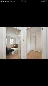 two pictures of a living room with a couch and a bedroom at Covent Garden 2 Bed Apartment in London