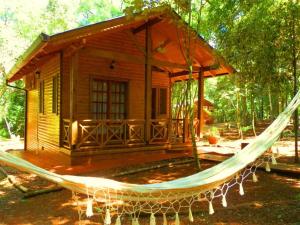 a hammock in front of a small house at La Linda Cabañas in Dos de Mayo +14 photos