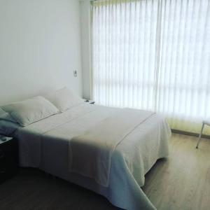 Postel nebo postele na pokoji v ubytování Hospedaje Tunja