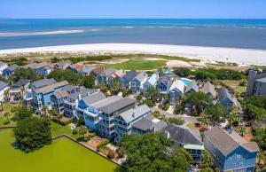 an aerial view of a resort with a beach at Pure Joy by AvantStay Beach Home w Amazing Views Community Pool in Isle of Palms