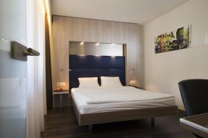 Posteľ alebo postele v izbe v ubytovaní Hotel Alexander Zurich Old Town
