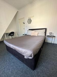 a bedroom with a large bed in a room at Clifton Street in Middlesbrough