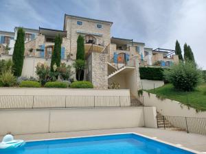 a house with a swimming pool in front of a house at Holiday Home Casa Diana by Interhome in Bibali