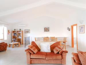 a living room with a couch and a table at Holiday Home Casa Diana by Interhome in Bibali