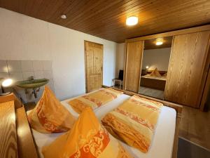 a bedroom with two beds and a sink and a mirror at Holiday Home Martin by Interhome in Wald