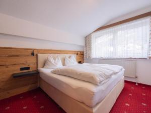 Postel nebo postele na pokoji v ubytování Apartment App- 102 by Interhome