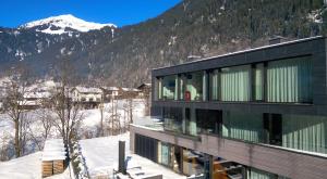 a house with a view of a mountain at Luxury architecture chalet with view and wellness in Bludenz