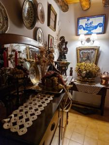 a room with a counter with plates on the wall at Casona Rey Fernando in Sos del Rey Católico