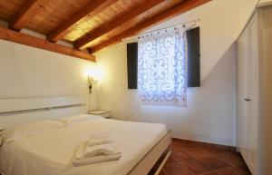 Ένα ή περισσότερα κρεβάτια σε δωμάτιο στο Elorina Casa Vacanze Birri sul mare Vendicari Noto