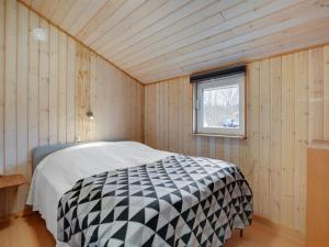 A bed or beds in a room at Holiday Home Alois - 31km from the sea in Western Jutland by Interhome