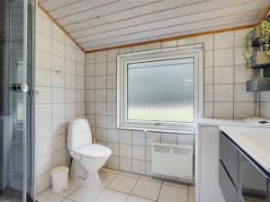 A bathroom at Holiday Home Alois - 31km from the sea in Western Jutland by Interhome